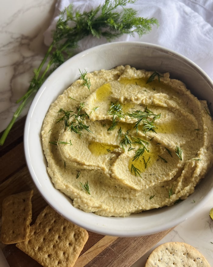 This is a picture of a close up of dill pickle hummus.