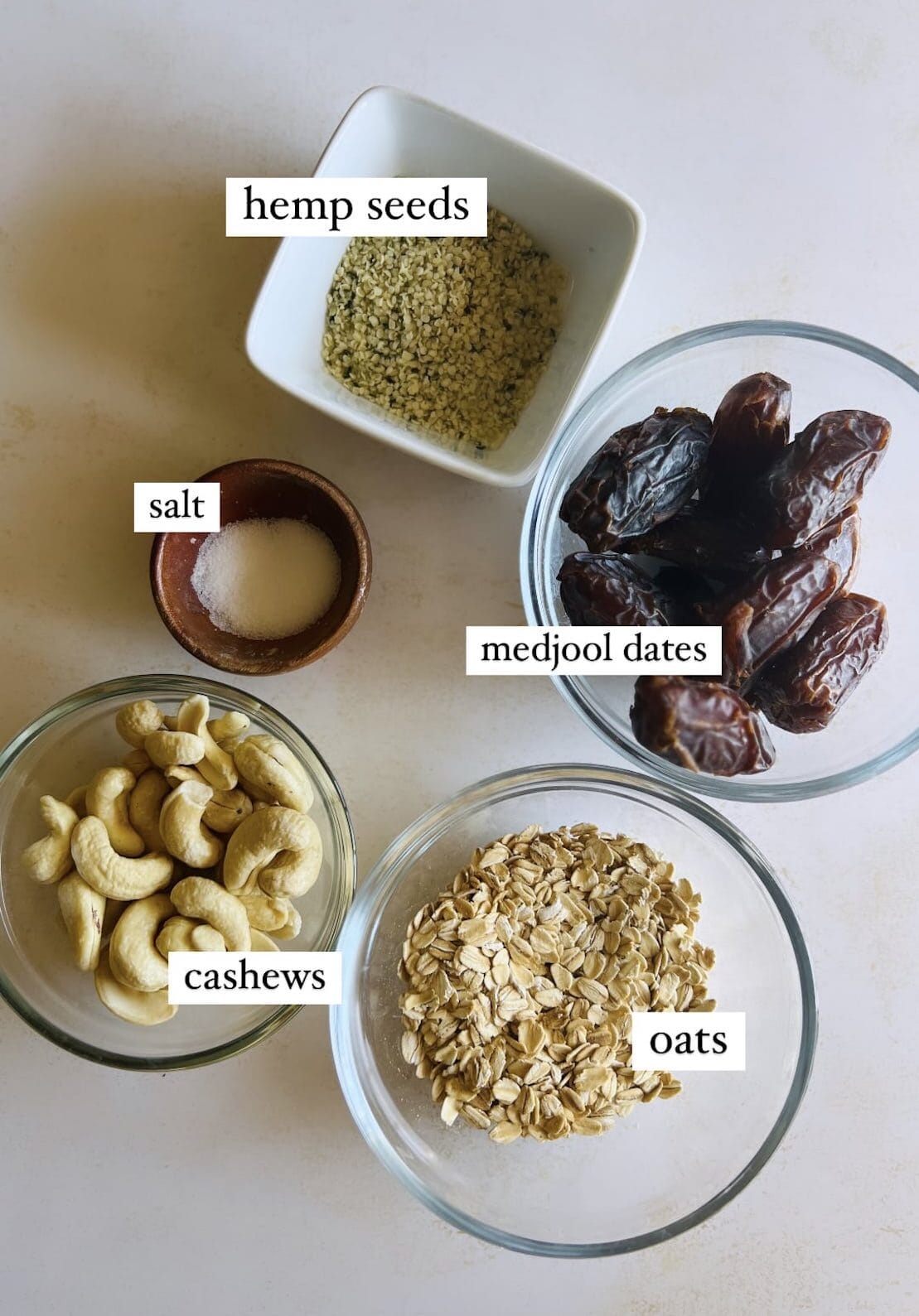This is a photo of the ingredients for the energy bites including dates, cashews, oats, salt, and hemp seeds.