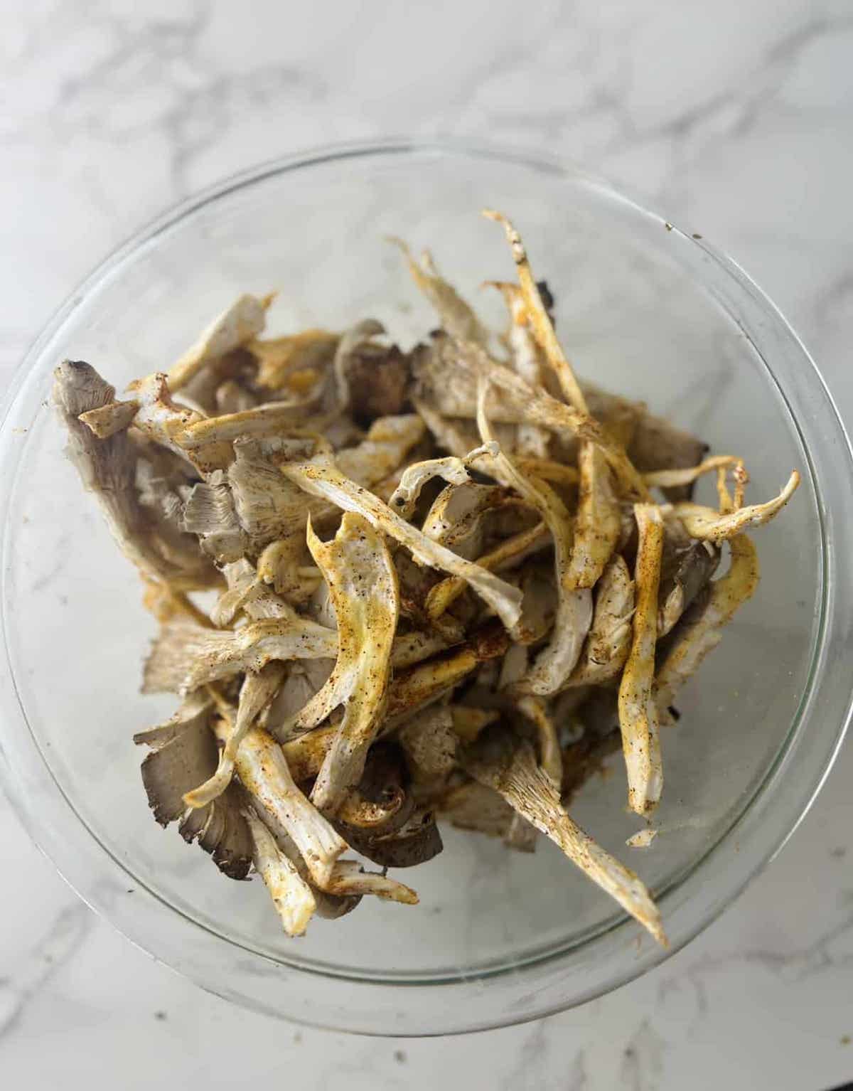 This is a photo of oyster mushrooms with marinade. 