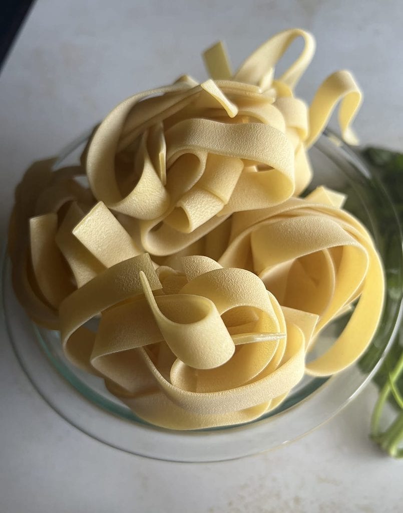 This is a photo of a close up of pappardelle noodles. 