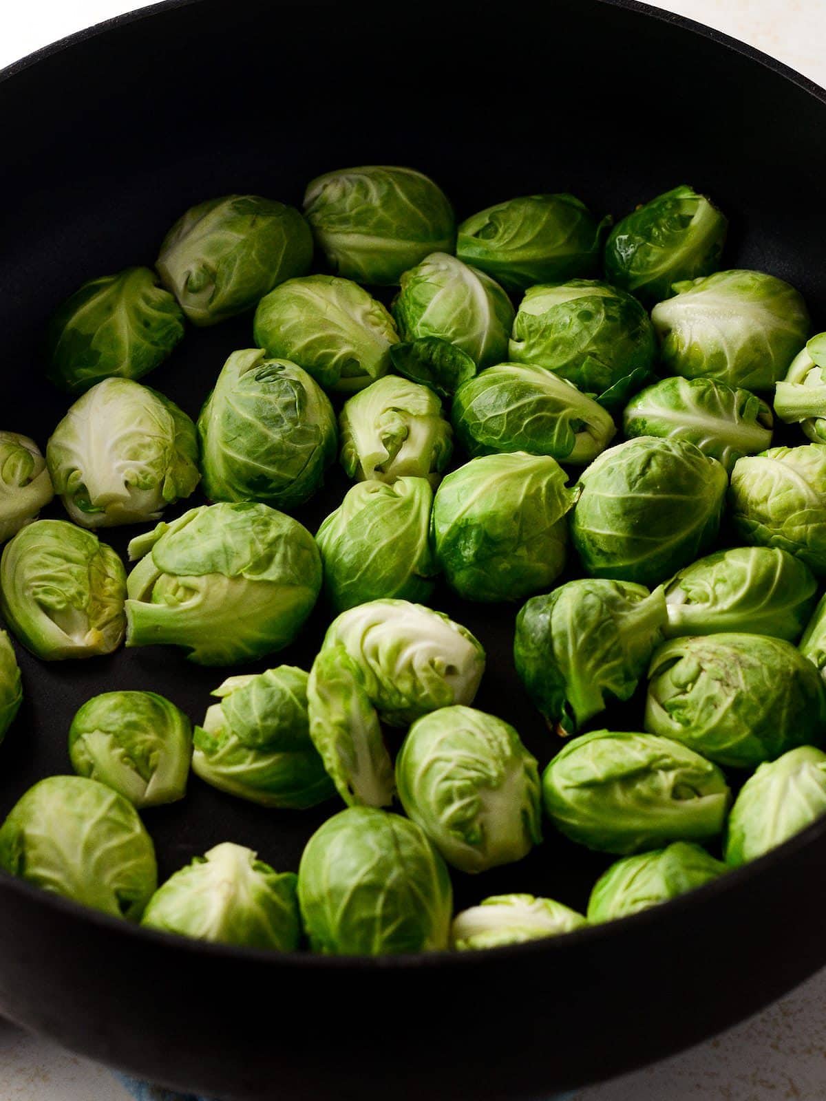 This is a photo of the brussels laid out face down in a pan. 