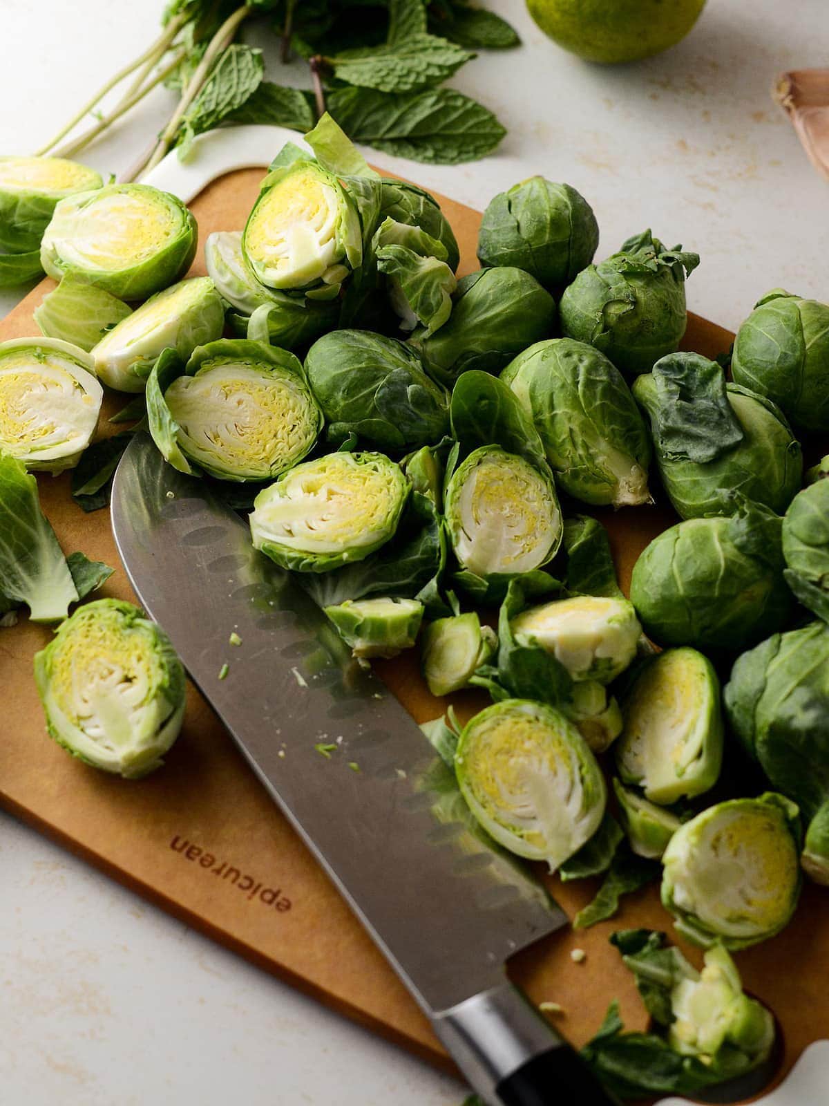 This is a photo of partially halved brussel sprouts.