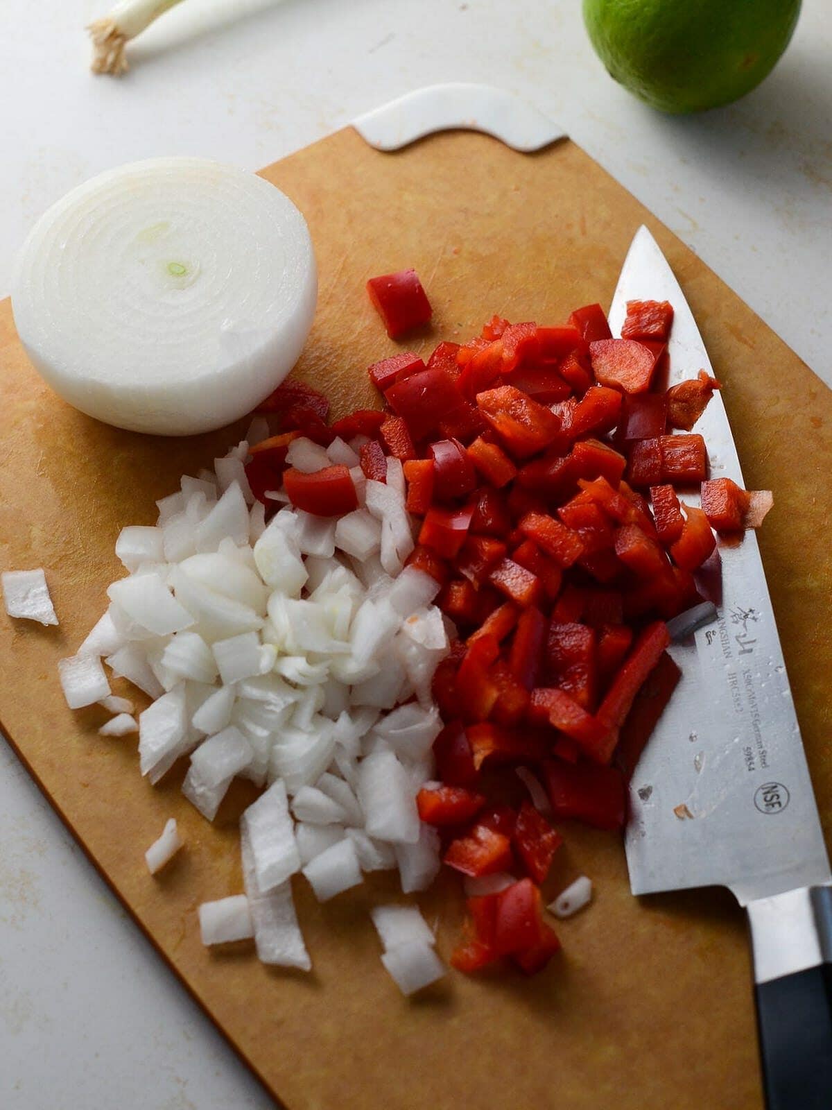 This is a photo of diced onion and red pepper.