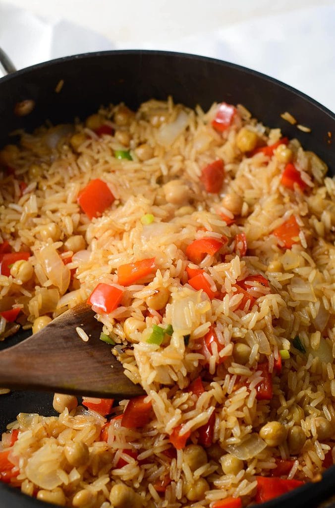 This is a photo of a spoon turning over the fried rice.