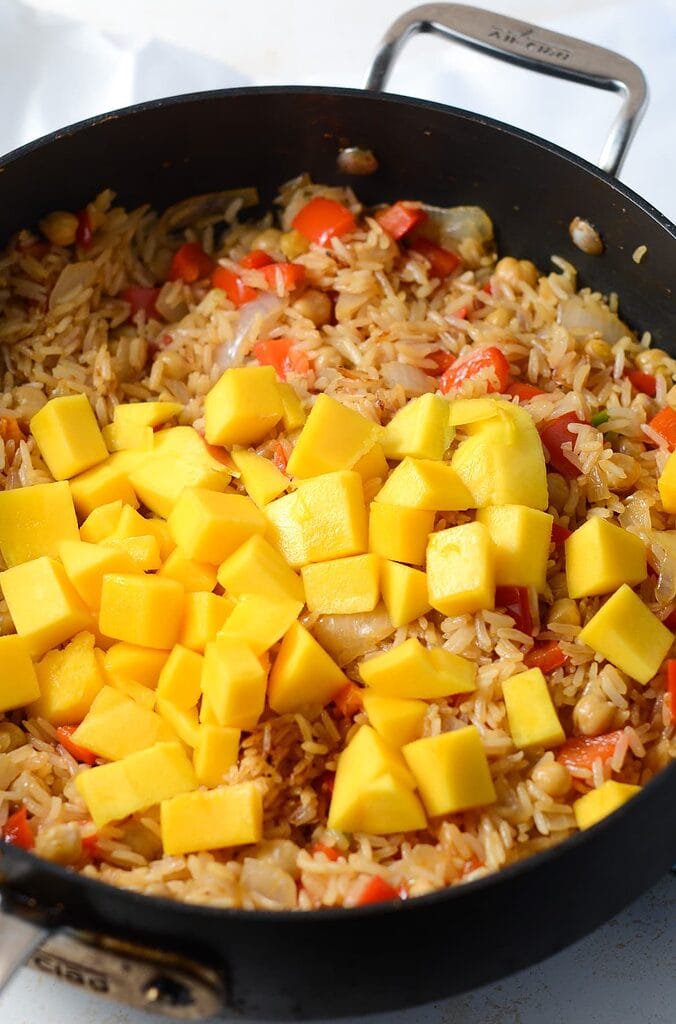 This is a photo of mango added to fried rice.