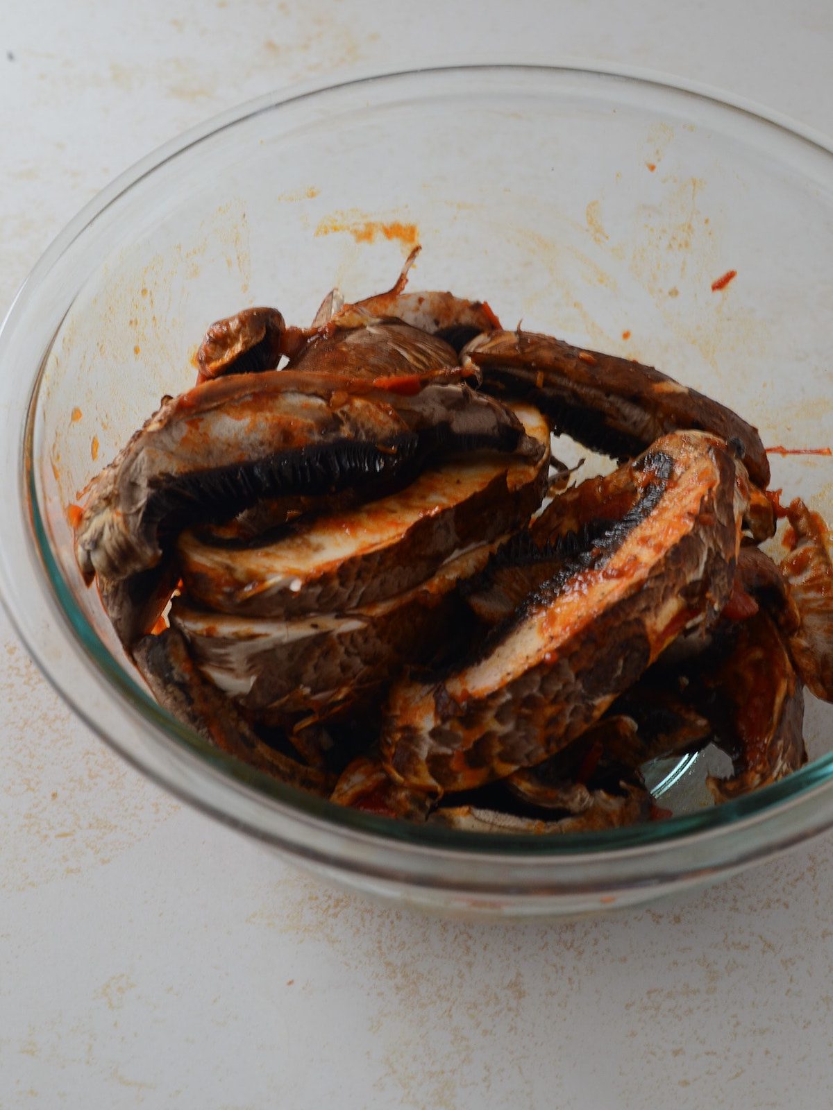 This is a photo of marinated sliced portobellos.