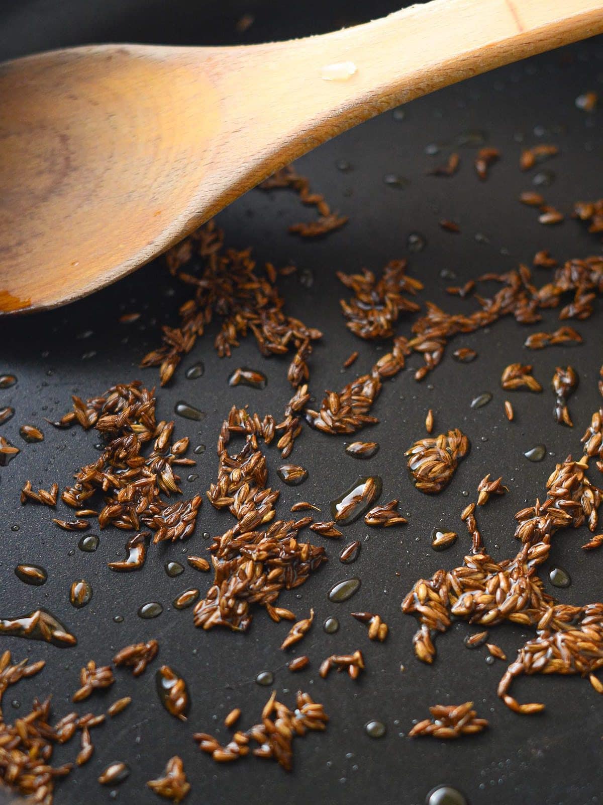 This is a photo of cumin seeds toasting.