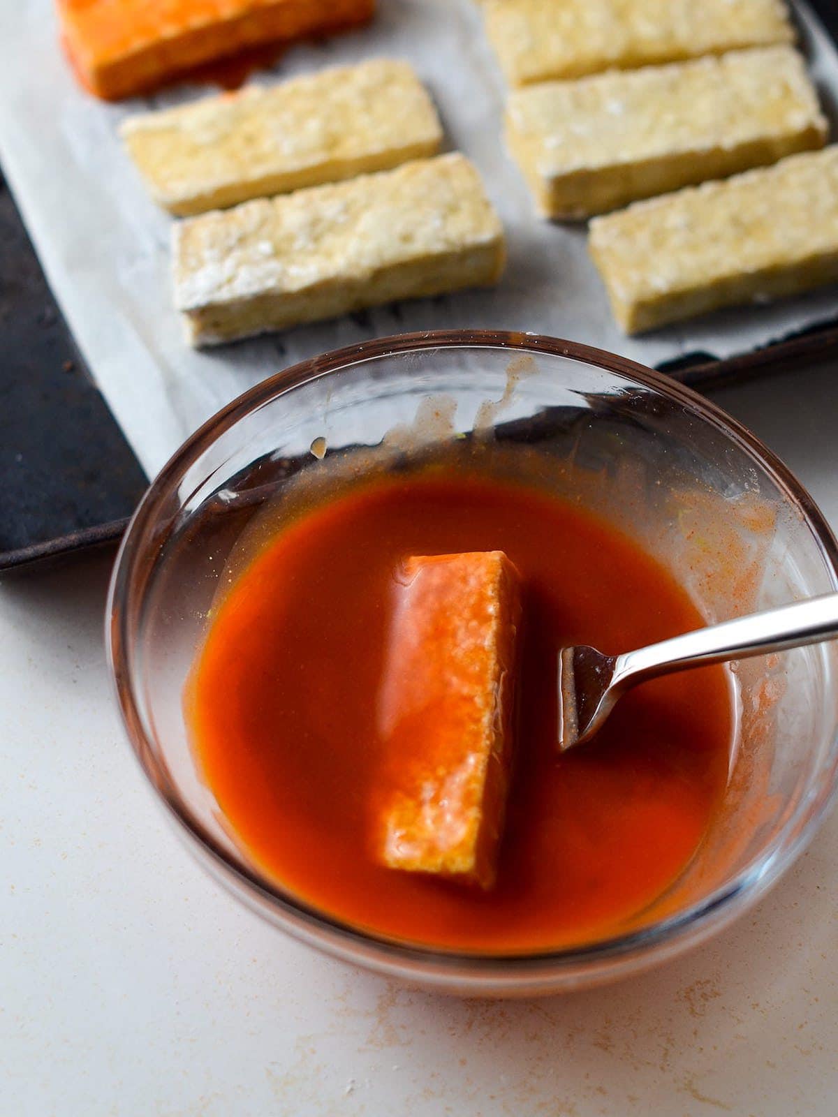 This is a photo of tofu in buffalo sauce.