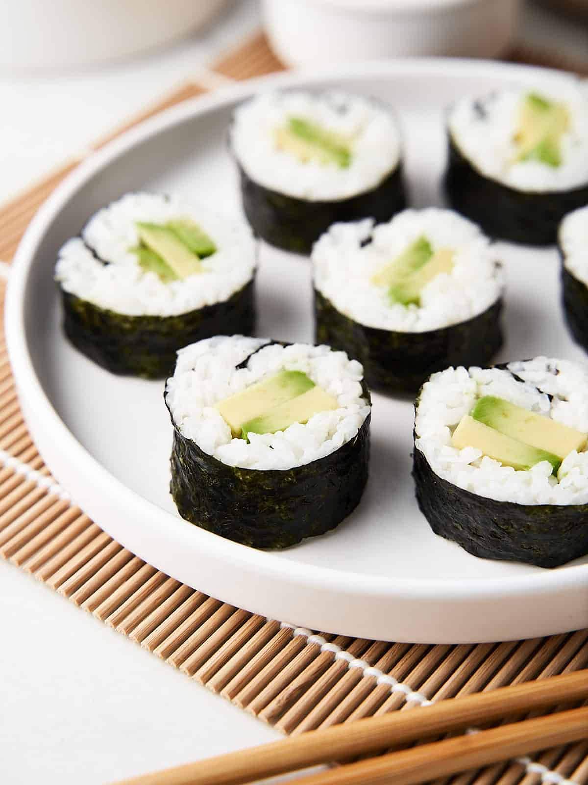 avocado rolls on a plate.