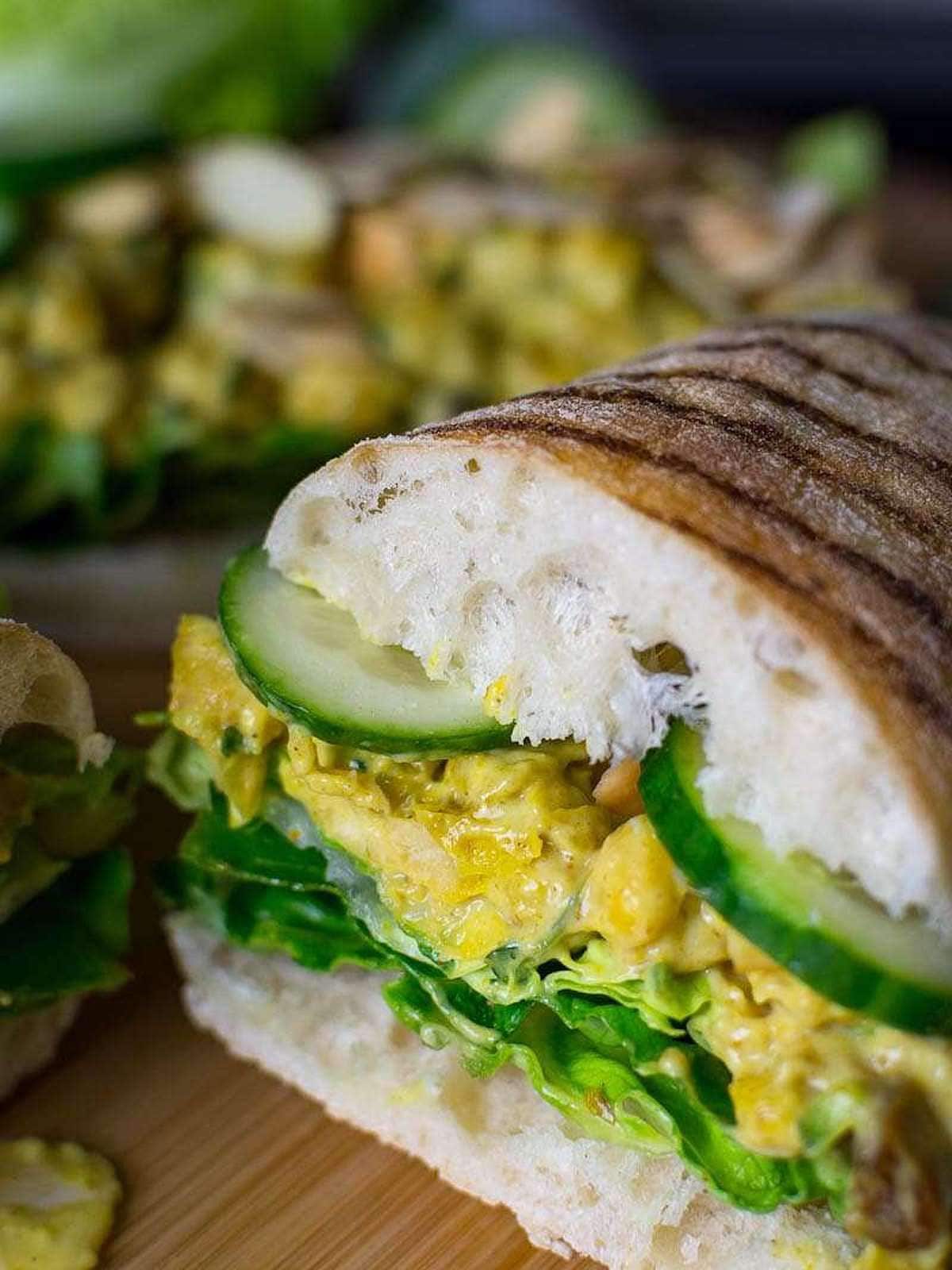 chickpea sandwich cut in half with grill marks on it. 