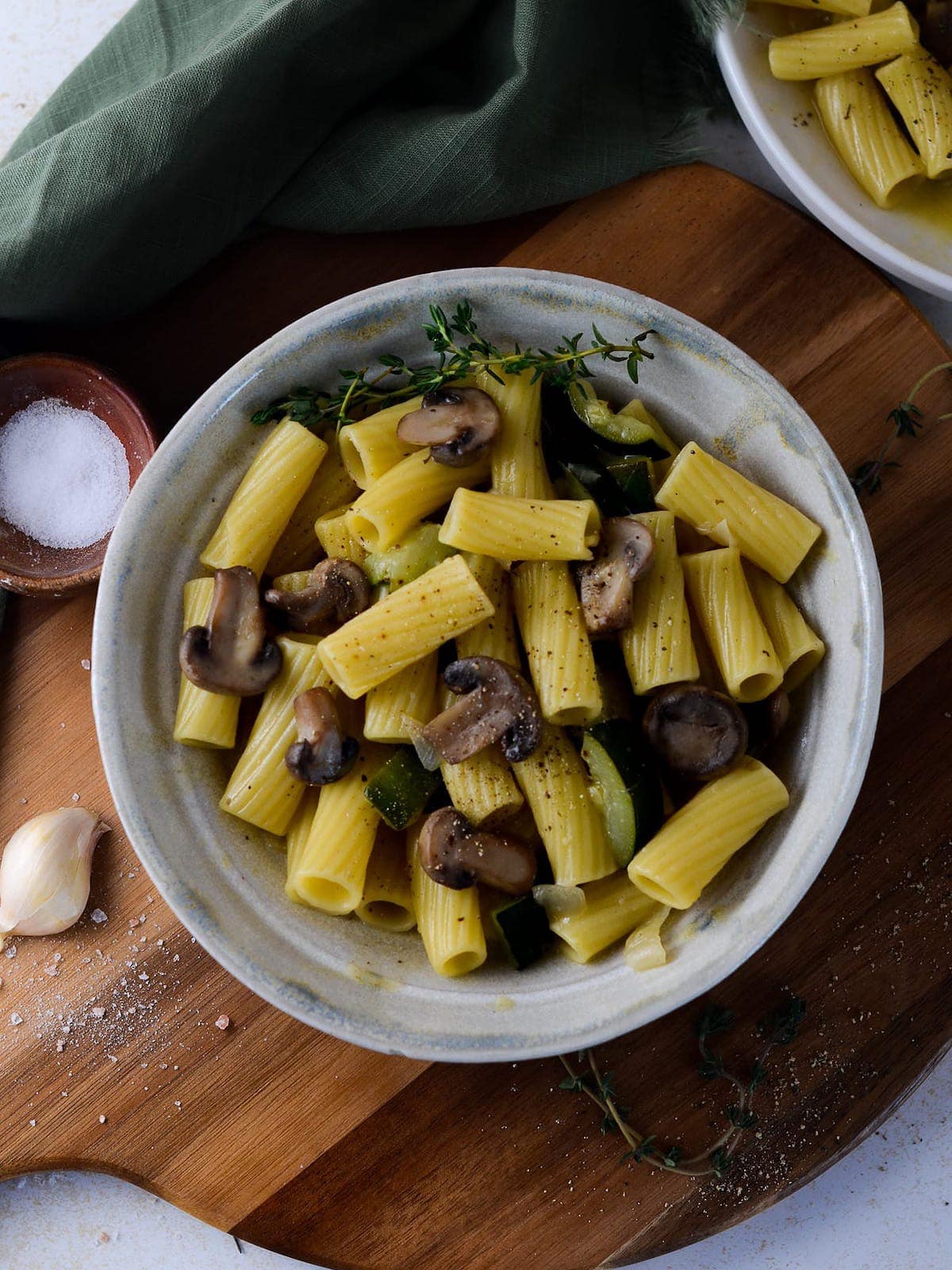 This is a photo of an overhead shot of one pot zucchini mushroom pasta. 
