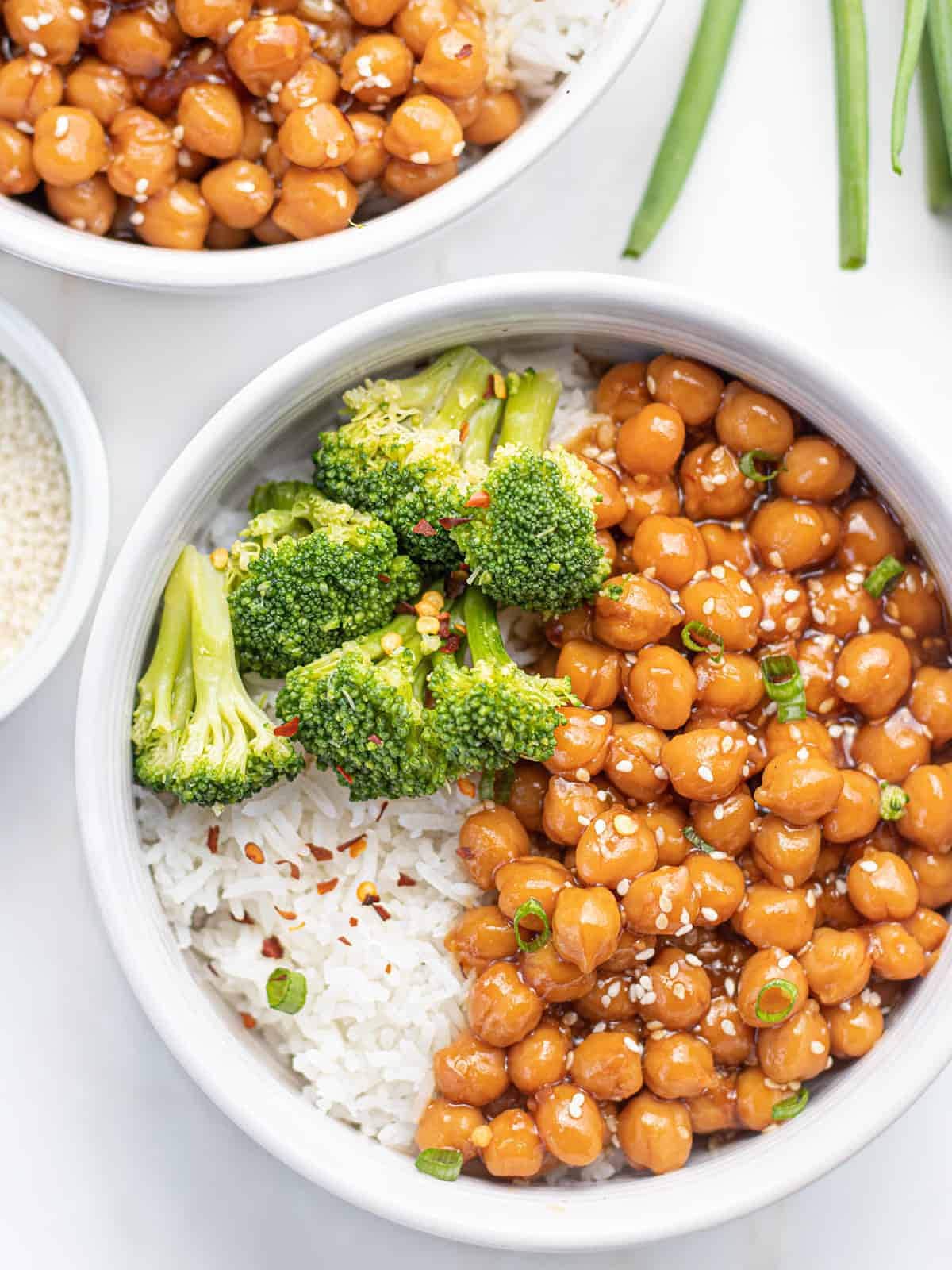 a bowl of sticky chickpeas with broccoli and rice.
