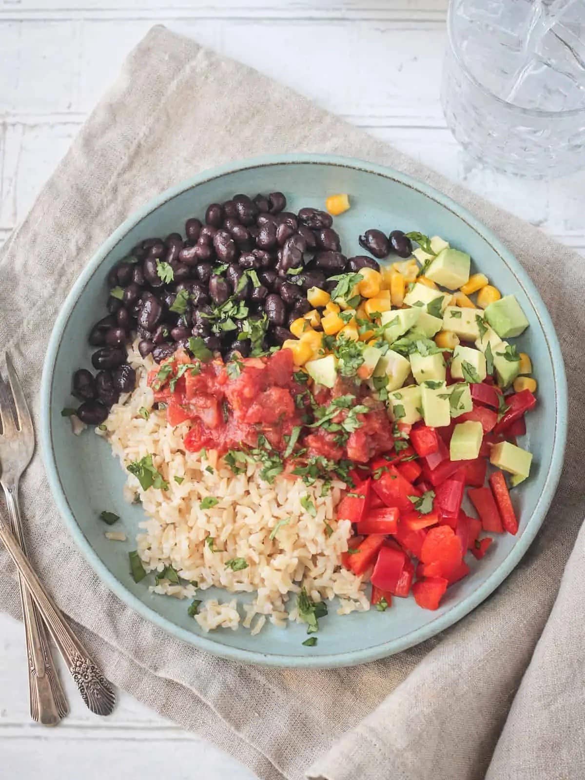 burrito bowl with a spoon on the side. 