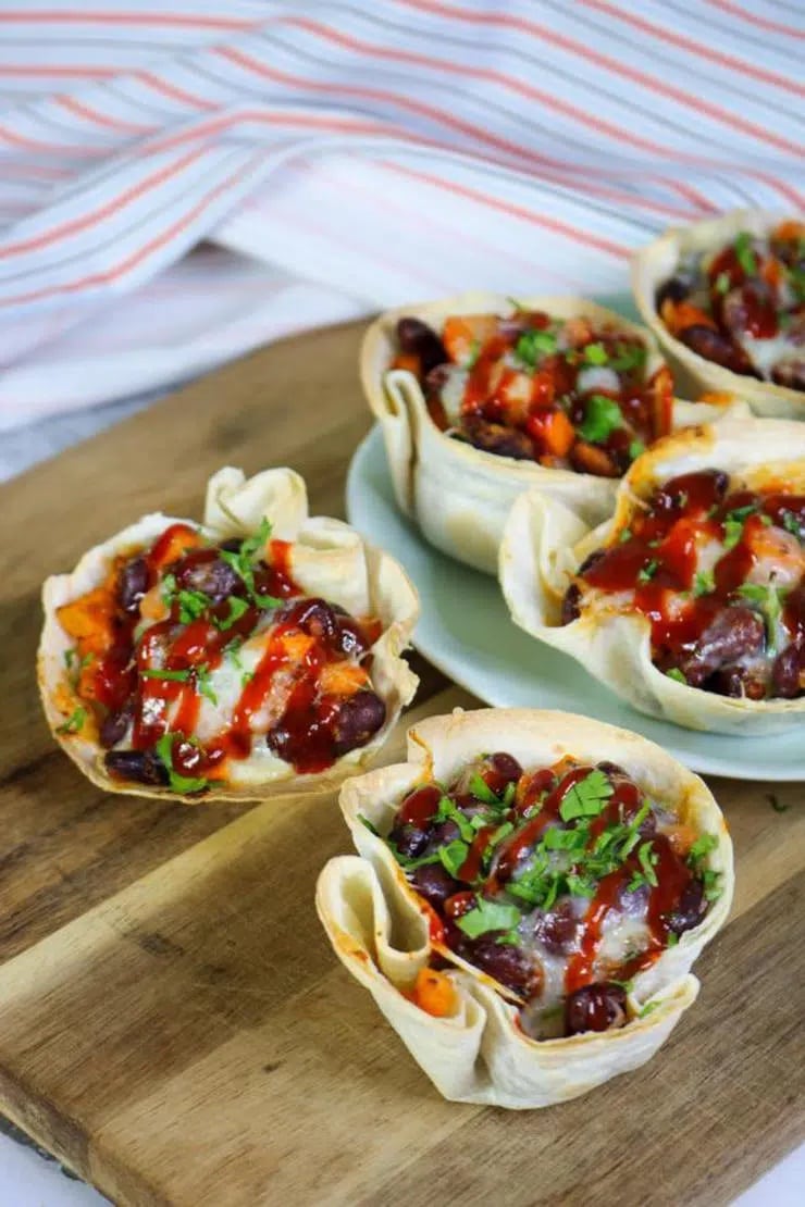 vegan taco cups on a cutting board. 