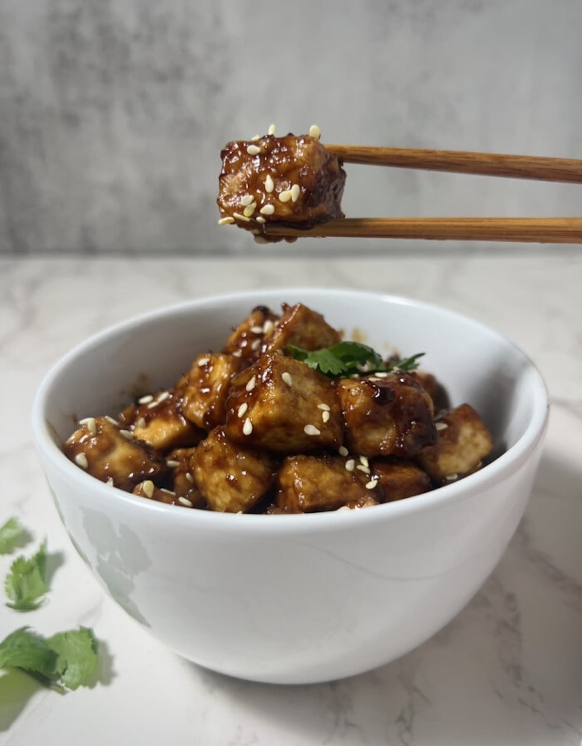 This is a photo of crispy asian air fryer tofu in a bowl. 