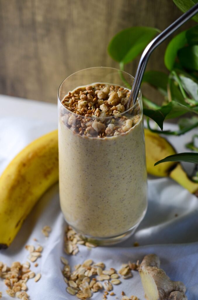 This is a photo of the gut health smoothie with granola, oats, and a banana.