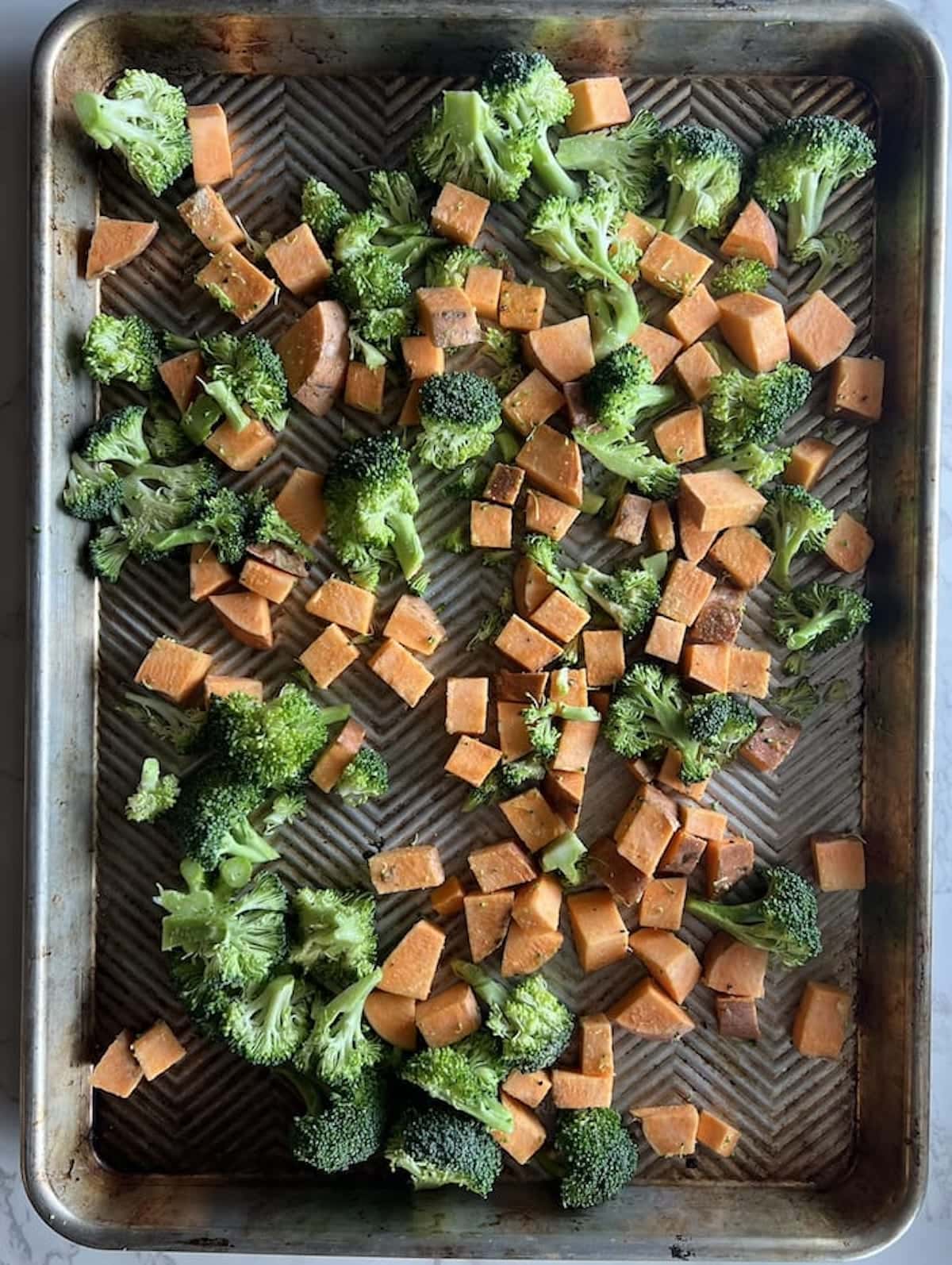 Pan of pre-roasted veggies.