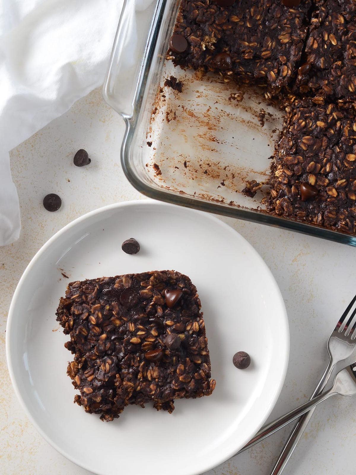 Photo of vegan brownie baked oatmeal in a square.