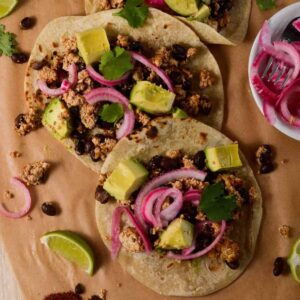 picture of tacos overhead shot. with limes and pickled onions