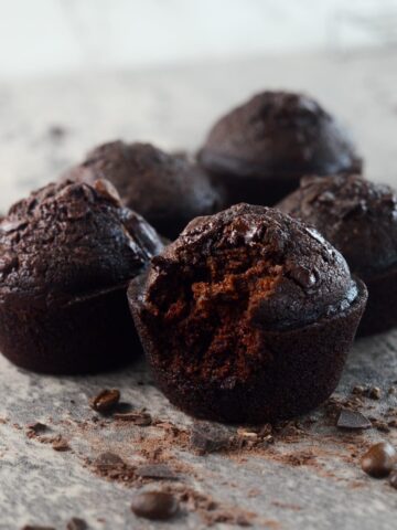 a chocolate espresso muffin amongst 4 other muffins