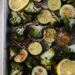 roasted broccoli and zucchini on a sheet pan.