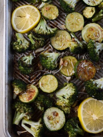 roasted broccoli and zucchini on a sheet pan.