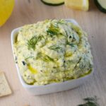 photo of roasted zucchini dip with lemon, zucchini, crackers and dill