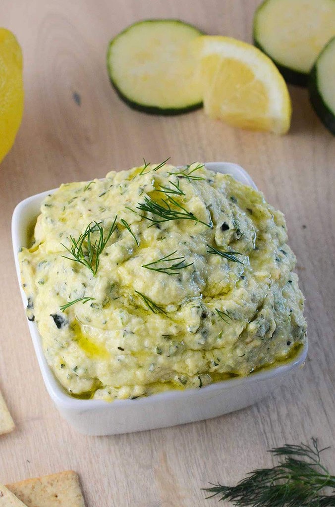 photo of roasted zucchini dip with lemon, zucchini, crackers and dill