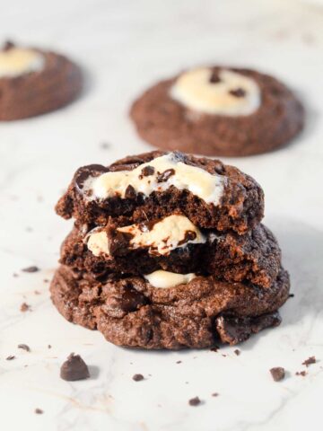 vegan hot chocolate cookies stacked on one another.