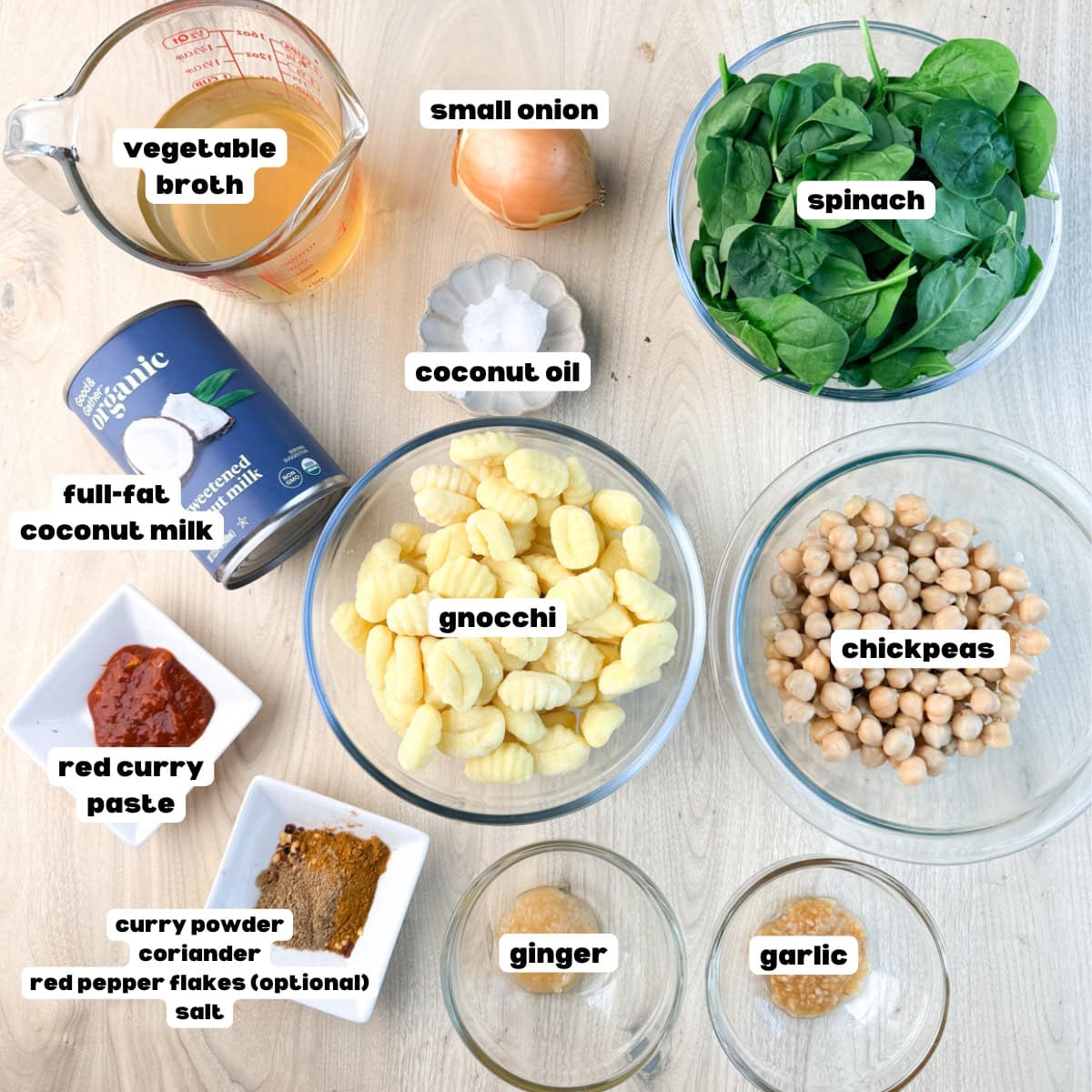 Coconut Curry Gnocchi ingredients including chickpeas, red curry paste, spinach, onion, vegetable broth, full fat coconut milk, mixed spices, ginger, and garlic